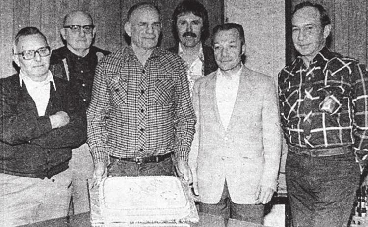 Members of the Gene Gelino American Legion Post were presented with a birthday cake last Tuesday to mark the post’s birthday. The cake, decorated in red, white, and blue, was baked by the Past Presidents of the American Legion Auxiliary and enjoyed by the veterans at their meeting. Pictured above are the Legion officers (L-R) Ken Reed, Dean Fett, Gilbert Elder, Jack Bickel, Andy Aberle, and Jim Hulm. Timber Lake Topic, March 25, 1982