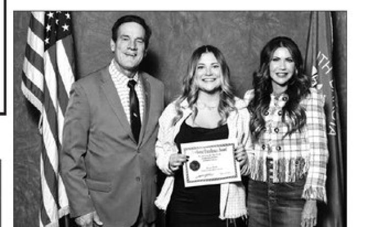 Kenna Webb of Timber Lake High School received a certificate from Gov. Kristi Noem (RIGHT) and Lt. Gov. Larry Rhoden at the Academic Excellence Recognition Luncheon.